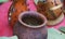 An African meal of green vegetables cooked in a pot and sour milk