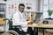 African medical worker in wheelchair checking x ray scan