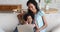 African mom and daughter use laptop relaxing on sofa