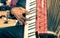 African musician hand playing fisarmonica accordion