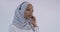 African Muslim customer representative business woman with headset helping and supporting online with customer