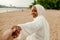 African Muslim Woman In White  Enjoying The Beach