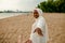 African Muslim Woman In White  Enjoying The Beach