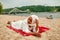 African Muslim Woman In White  Enjoying The Beach