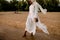 African Muslim Woman In White  Enjoying The Beach