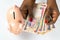 African Nigerian woman holding Nigerian Naira in white background with piggy bank