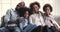 African parents posing for portrait sit with children on sofa