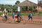 African peasants transported cargo on road bikes.