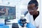 African pharmacology researcher analysing chemical substance