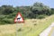 African road sign depicting an animal - a hyena on the road