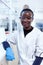 African scientist wearing protective glasses in medical laboratory