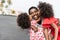 African sisters twins kissing mother on the beach - Black family having fun outdoor during summer vacation - Love, real people and