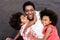 African sisters twins and mother playing on the beach at sunset time during summer vacation - Main focus on girls faces