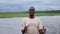 African smiling man driving a boat cruise on Chobe river in Botswana.