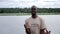 African smiling man driving a boat cruise on Chobe river in Botswana.