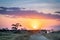 African sunset over safari vehicles in the Masai Mara, Nairobi