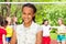 African teen girl and friends playing volleyball