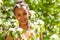 African teenager girl with flowers on pear tree