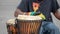 African themed drummer beating drums at a performance