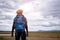 African tourist  traveler man with backpack on view of mountain background