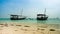 African touristic boats near a sandy shore, timelapse