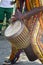 African in traditional costume playing drum. Hand movement. African concert