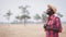 African Traveler man or photographers standing and traveling in the savannah fields