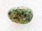 african turquoise gemstone on white marble