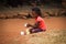 African village children play near their homes in the Kampala suburb