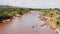 African Wildlife Aerial Shot of a Group of Hippos on the Masai Mara River Banks, Drone View of Beaut