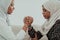 African woman arm wrestling conflict concept, disagreement and confrontation wearing traditional islamic hijab clothes