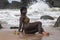 African woman on a beach in Axim Ghana.