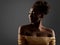 African Woman Black Silhouette. Dark Skin Beauty Model with Golden Make up Profile Side View over Gray. Fashion Girl Face Portrait