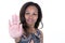 African woman blurred with curly hair showing stop gesture with her hand posing against white studio wall