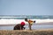 African woman and child catching crabs