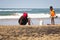 African woman and child catching crabs