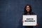 African woman hold white board with Maputo Mozambique inscription. Most populous city in Africa concept