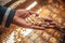 An African woman holds a grain of corn in her hands, source of food sustenance for Africans. Illustrative photo about food and