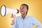 African woman, megaphone and shout in studio with speech, ideas and thinking by yellow background. Girl, student and