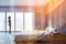 African woman in panoramic gray bedroom