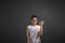 African woman with perfect hand signal on blackboard background