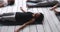 African woman practicing Savasana position during yoga class indoors