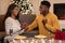 African Woman Proposing To Man Showing Engagement Ring Box Indoor