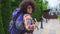 African woman tourist with an afro hairstyle rear view slow mo