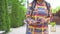 African woman tourist with an afro hairstyle uses a smartphone