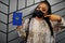 African woman wearing black face mask show Djibouti passport in hand. Coronavirus in Africa country, border closure and quarantine