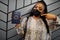 African woman wearing black face mask show Eritrea passport in hand. Coronavirus in Africa country, border closure and quarantine