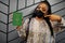 African woman wearing black face mask show Mauritania passport in hand. Coronavirus in Africa country, border closure and