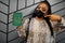 African woman wearing black face mask show Sierra Leone passport in hand. Coronavirus in Africa country, border closure and