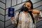 African woman wearing black face mask show South Sudan passport in hand. Coronavirus in Africa country, border closure and
